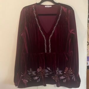 Loveriche burgundy top with embroidered details.